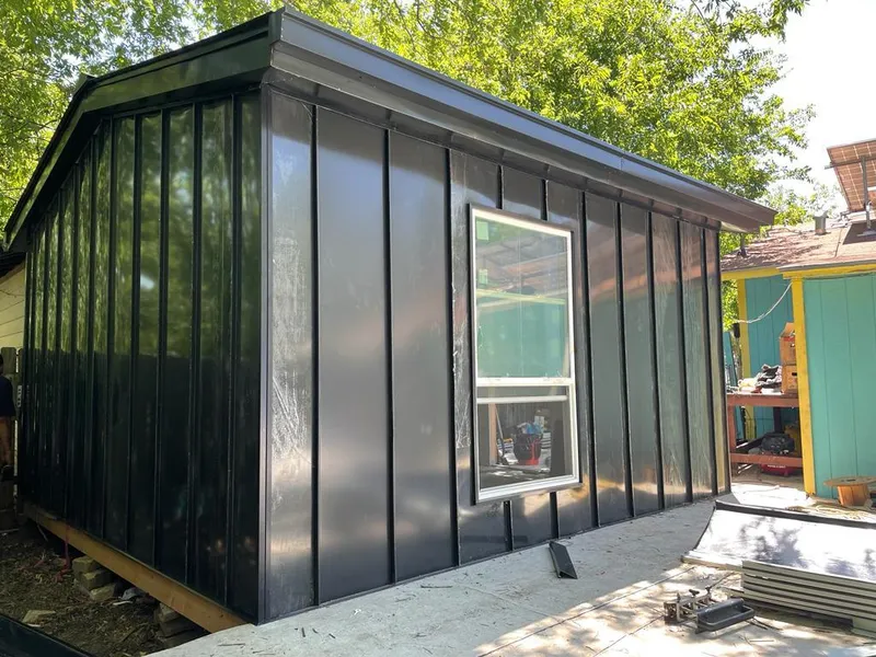 Black standing seam metal wall panels for Roof Inspection in Hastings